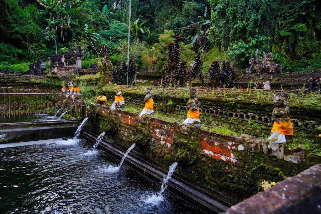 Sacred water temple with traditional offerings in Bali
